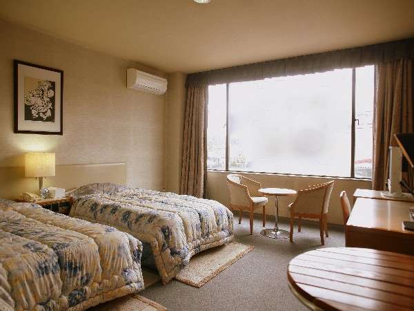 洋室ツインタイプです。お部屋は広々高山観光の後はゆっくりとお過ごしください(一例)